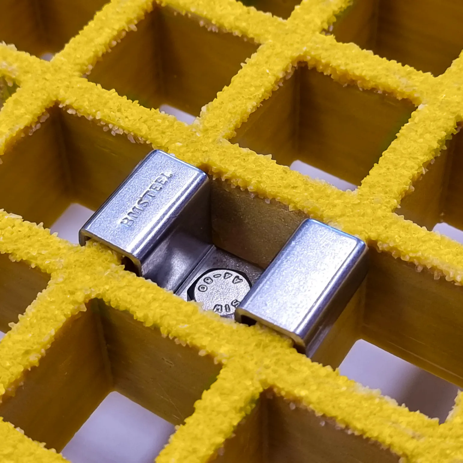 M-Clip Fixing
Stainless steel M-Clips secure open mesh GRP grating to support structures, preventing rotation in all directions
Quick, easy, and cost-effective method of fixing panels.
Available for all standard panel thicknesses: 14/15mm, 25mm, 30mm, 38mm, 50mm and mini-mesh 15mm, 22mm, 30mm and 38mm
Ideal for fixing and joining GRP panels on walkways and platforms, and stair treads