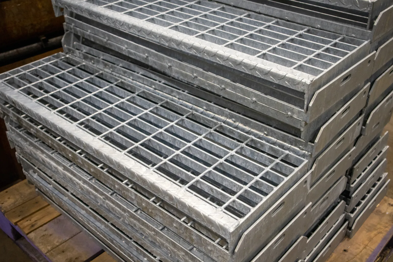 Open Steel Flooring Stair Treads (41/100 apertures)

Open steel flooring stair treads provide a durable step surface with excellent drainage, making them particularly effective in wet, exposed or industrial environments. The open construction allows water, debris and contaminants to pass through the tread, helping maintain a safer walking surface.&nbsp;

These treads are supplied with drilled end plates for straightforward bolting to supporting stringers, supporting quick and secure installation on site.&nbsp;

Standard specifications include:&nbsp;


	Available in self-colour or galvanised steel&nbsp;
	Four standard sizes:&nbsp;
	
		800 x 283mm&nbsp;
		800 x 242mm&nbsp;
		1000 x 283mm&nbsp;
		1000 x 242mm&nbsp;
	
	
	Bespoke sizes available on request&nbsp;


Open steel treads are commonly specified for industrial access stairs, platforms and external walkways where drainage and long-term durability are required.&nbsp;
