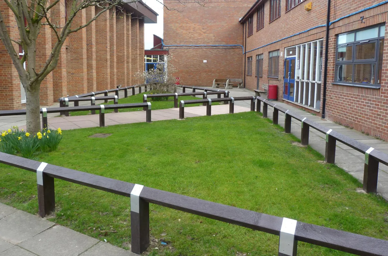 When you need to define boundaries, guide pedestrians, or protect restricted areas, the right fencing and barrier systems can make a major difference to both safety and aesthetics — especially in outdoor environments where timber can quickly degrade.
At Barclay & Mathieson, we supply a range of barriers, fencing and planters manufactured from 100% recycled plastic, saved from landfill. These products are designed for long-term external use and provide a durable, low-maintenance alternative to traditional timber systems.
Unlike wood, recycled plastic will not rot, warp or splinter. It can withstand harsh UK weather conditions, including persistent rain, frost and UV exposure, with minimal upkeep, helping reduce lifetime costs.