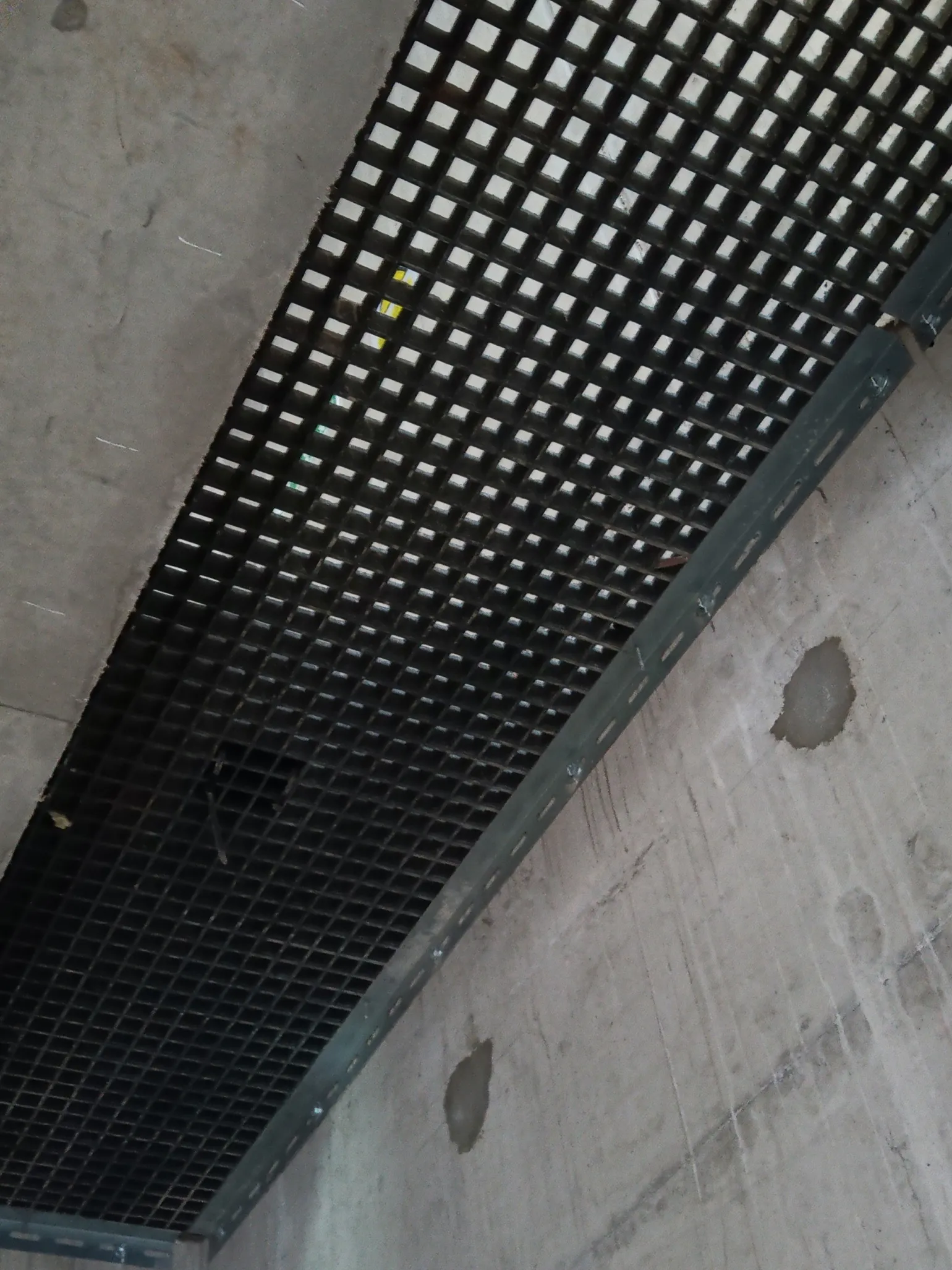 Permanent Access Solutions for Completed Buildings
Permanent access systems are critical in high-rise and multi-storey buildings, particularly in service areas that require ongoing inspection and maintenance.
Service Voids
Riser void flooring provides safe access within vertical service risers, allowing maintenance personnel to work securely within buildings long after construction is complete.
Our steel-supported GRP riser flooring systems are purpose-designed to suit the specific geometry and load requirements of each project. Systems can be post-fixed for retrofit applications or supplied as pre-built riser boxes for casting into the concrete frame, supporting safer and more efficient construction.
By combining the structural strength of steel with the slip-resistant performance of GRP grating, these systems deliver reliable, long-term access for M&E risers in residential, commercial and mixed-use developments.