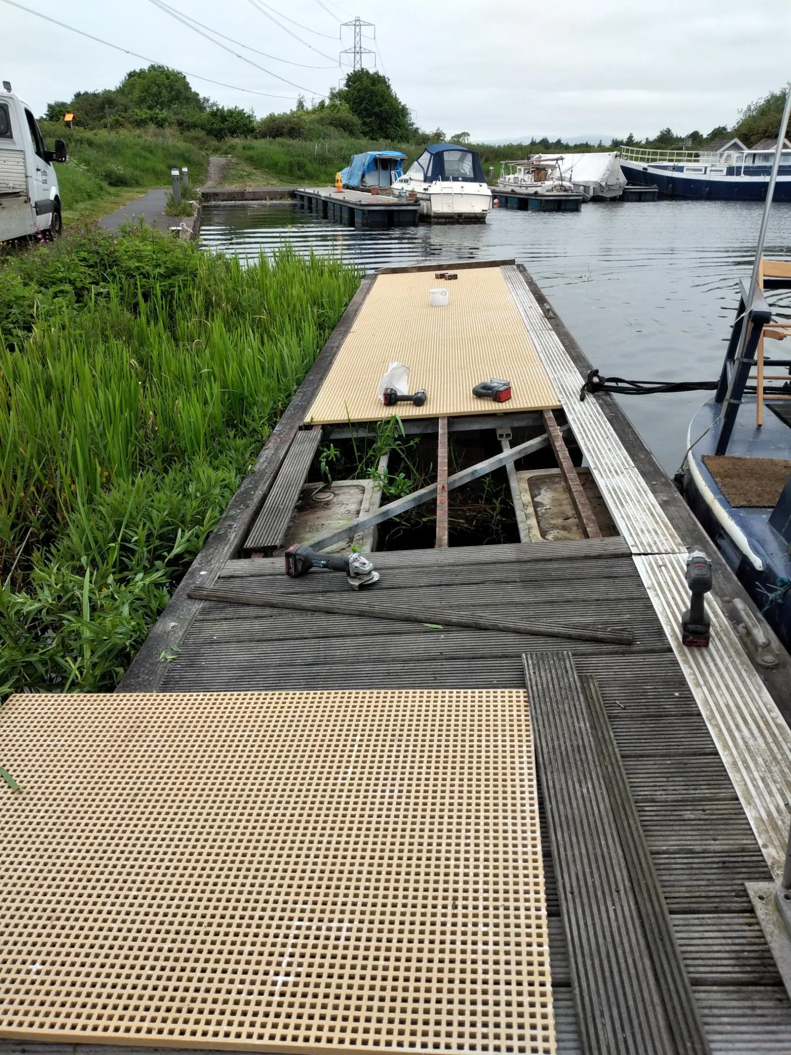 Replacing Timber Walkways with GRP
Rotting, warped and algae-covered timber jetties and walkways are a common issue in wetland or coastal environments. While timber may initially blend into the natural landscape, it often becomes slippery, structurally compromised and maintenance-intensive over time.
Glass Reinforced Polymer (GRP) offers a proven alternative that delivers long-term safety and performance without ongoing upkeep.
GRP grating provides a stable, slip-resistant surface even in persistently wet conditions, while its non-corrosive construction ensures consistent performance year after year without further treatment.
Our GRP Anti-Slip Decking Strips are ideal for installing onto timber pontoons to provide an immediate slip-resistant surface. They are also ideal for installing onto public rights of way including boardwalks and footbridges.
Mini-mesh GRP Grating
Our Mini-mesh GRP grating is particularly well suited to environmental and waterside applications where both safety and functionality are critical. Its reduced aperture size significantly lowers the risk of personal items or maintenance equipment being dropped and lost through the walking surface.
At the same time, the gritted open-mesh design still prevents slips and allows effective drainage, preventing the build-up of standing water and reducing the build-up of algae and surface contamination.
Mini-mesh GRP grating is commonly specified for towpaths, jetties, viewing platforms and maintenance access routes where public safety, environmental protection and ease of maintenance must all be carefully balanced.