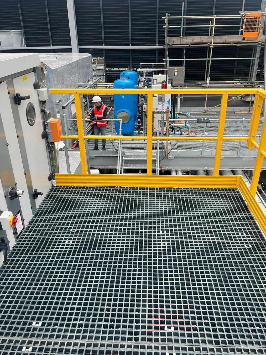 Roof Access & Equipment Maintenance

Rooftop environments on telecommunications and data centre facilities often house antennas, cooling plant, containment systems and enhanced service cabling that require regular inspection and maintenance.&nbsp;

To support safe movement across these complex roof layouts, we supply GRP handrailed walkways and step-overs that create clearly defined pedestrian routes while protecting roof membranes and finishes. The slip-resistant GRP walking surfaces provide reliable footing in exposed conditions, while integrated handrails deliver continuous edge protection for personnel working at height.&nbsp;

Where enhanced service cabling, pipework or containment systems cross pedestrian routes, GRP fabricated step overs provide a safe and practical solution. These purpose-built units allow maintenance teams to step cleanly over obstructions without placing load on critical services, helping prevent damage while reducing trip and fall risk.&nbsp;

Lightweight, non-conductive and corrosion resistant, GRP step overs are ideally suited to rooftop data and telecoms environments, where safety, equipment protection and long-term performance are essential.
